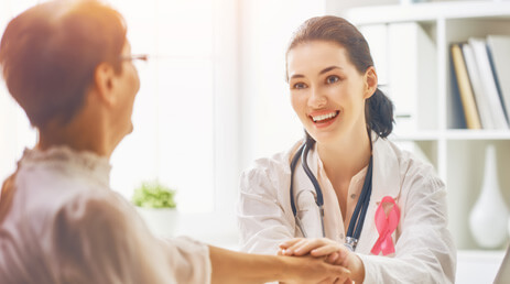 Stock image of doctor convincing her patient for getting diagnostic mammography