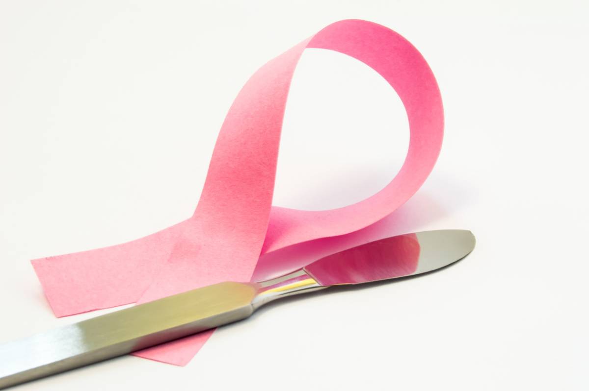 Concept image referring to breast biopsy with pink ribbon